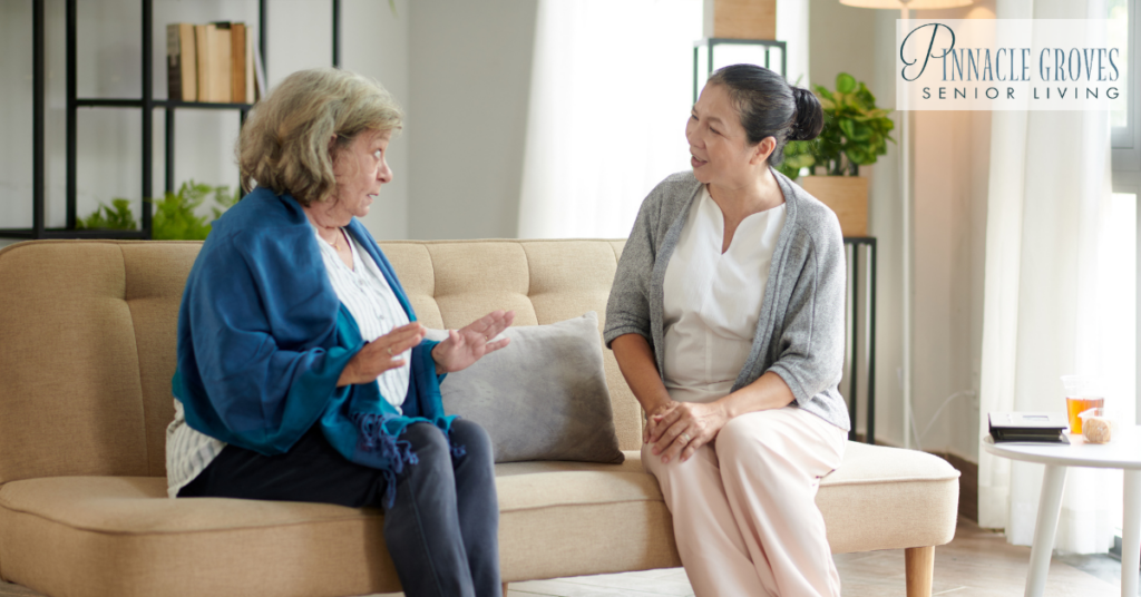 A senior woman is listening to her friend. Communication with memory care residents.